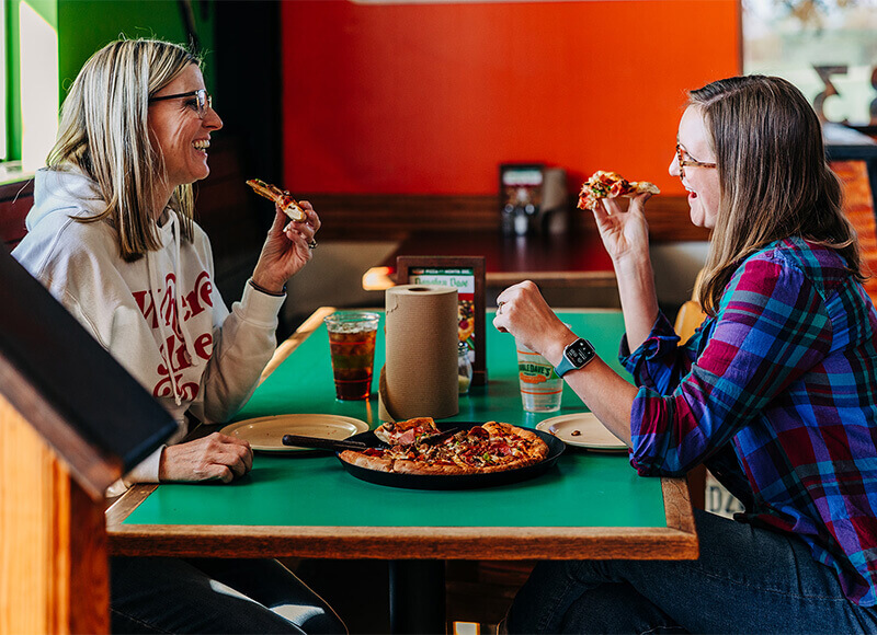 Customers enjoying DoubleDave's Pizza