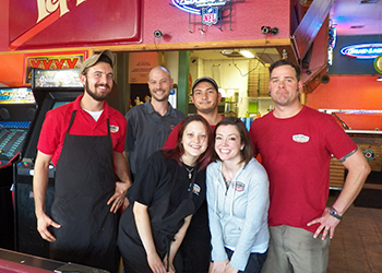 DoubleDave's employees posing in the pizzeria