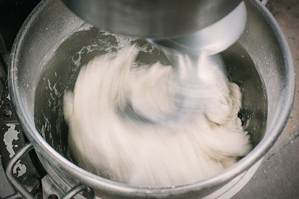 Pizza dough being made